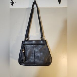 Tignanello leather navy blue shoulder tassel charm attached to zipper Like New